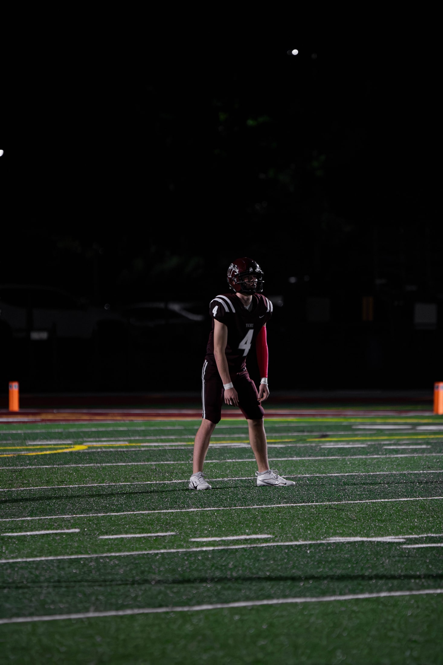 East Lyme number 4 set on the field under the stadium lights