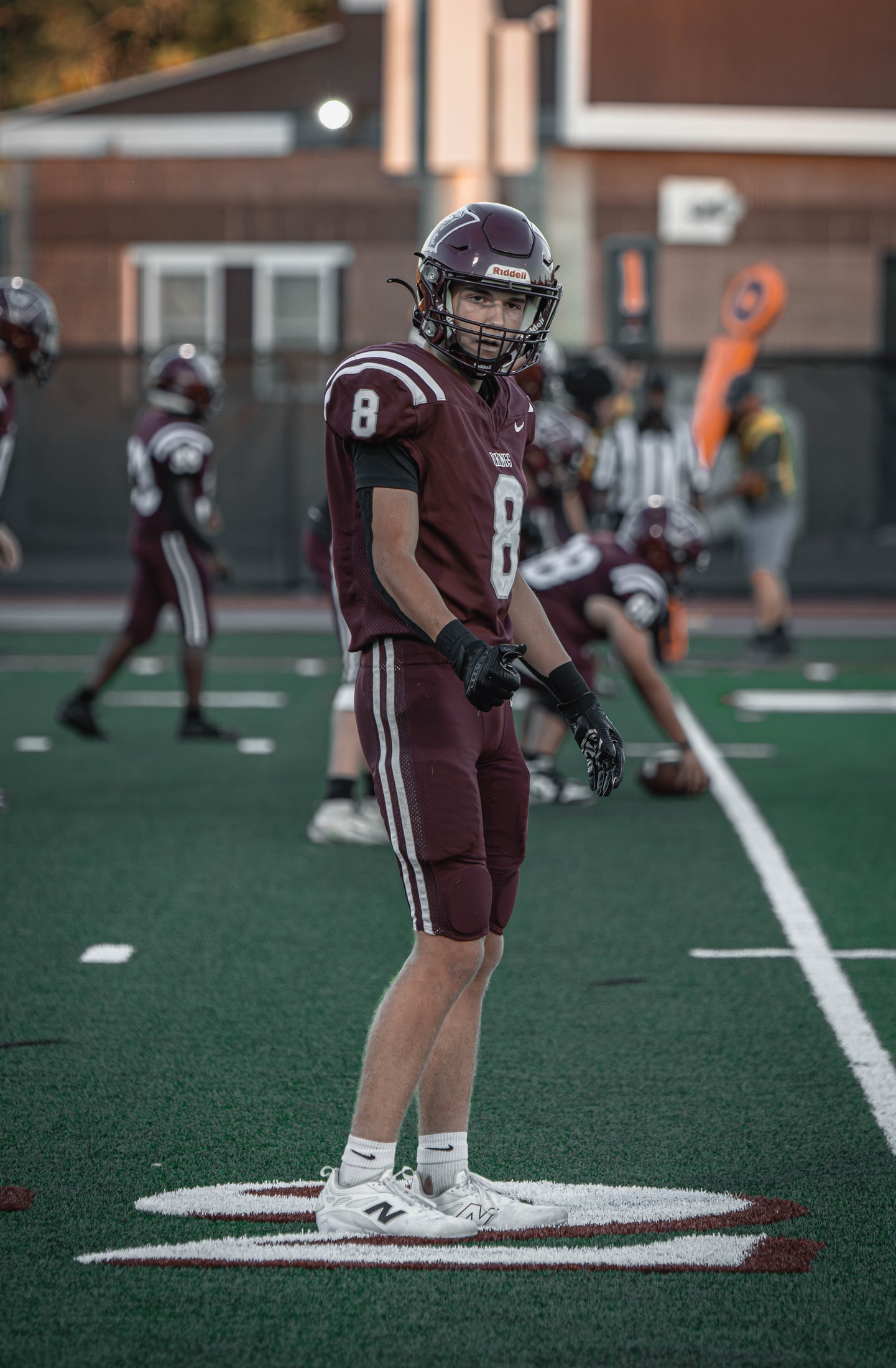 East Lyme number 8 standing on the field before the next play