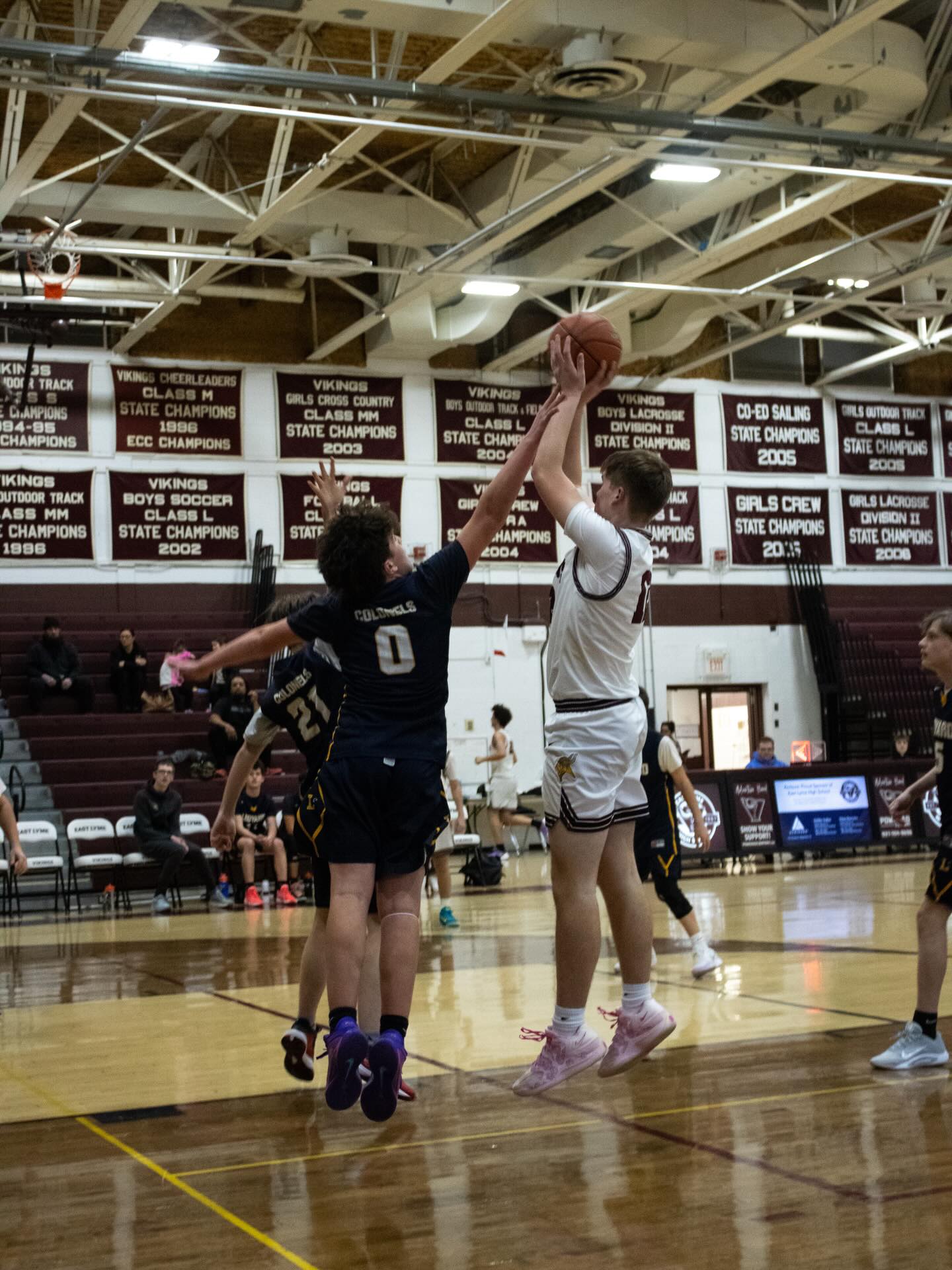 East Lyme basketball player rising for a shot over a defender