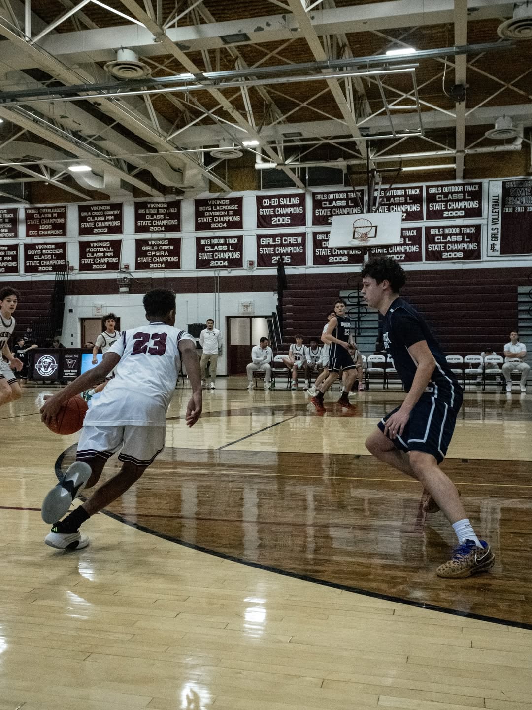 East Lyme number 23 dribbling toward a waiting defender