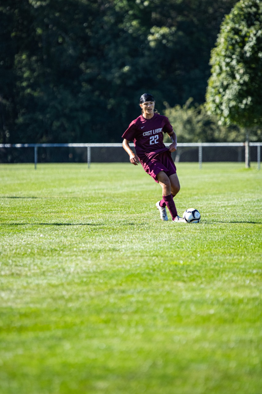 East Lyme number 22 dribbling into open space