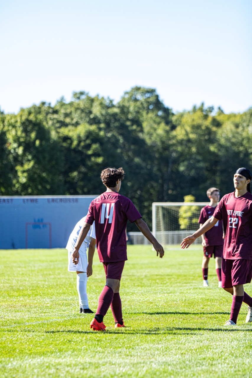 East Lyme soccer players regrouping in midfield