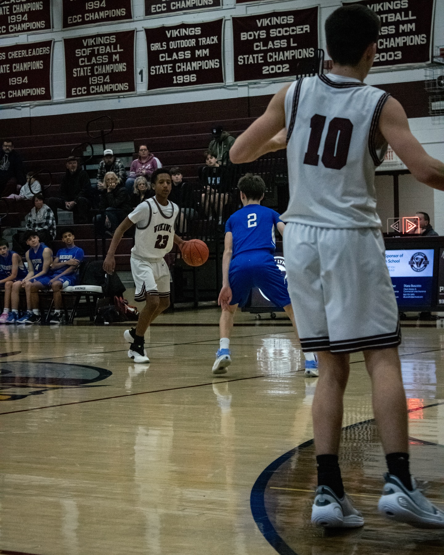 East Lyme guard bringing the ball up the floor in transition